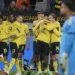 Borussia Dortmund players celebrate Maximilian Beier’s late winning goal against Eintracht Frankfurt in the Bundesliga.