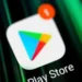 Google Play Store app on a smartphone screen amid UK legal action